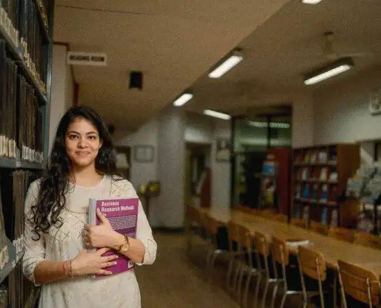 IIHMR University student in the campus library